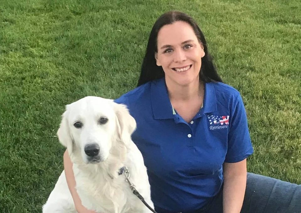 Cindy, founder of Westwing Retrievers, with a cream golden retriever